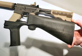 A bump fire stock that attaches to a semi-automatic rifle to increase the firing rate is seen at Good Guys Gun Shop in Orem, Utah, U.S., October 4, 2017.