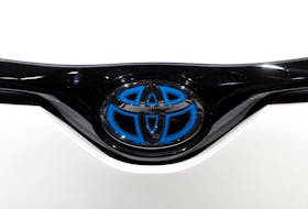 The Toyota RAV4 Hybrid logo is seen during the first press day of the Paris auto show, in Paris, France, October 2, 2018.