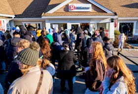 Black Friday shoppers stand in line for a Lululemon store as retailers compete to attract shoppers and try to maintain margins on Black Friday, one of the busiest shopping days of the year, at Woodbury Common Premium Outlets in Central Valley, New York, U.S. November 24, 2023. 