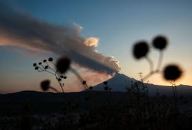 Popocatepetl volcano spews a column of ash and smoke as authorities declare a yellow alert after an increase in volcanic activity, as seen from Santiago Xalitzintla, in the state of Puebla, Mexico, February 22, 2024.