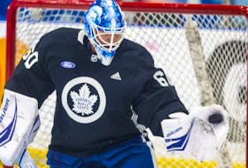 Goalie Joseph Woll makes a save during the first day of Toronto Maple Leafs training camp.