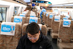 Zhang Baichuan, 23, rides a train to attend a job fair in Shijiazhuang, at a railway station in Beijing, China February 24, 2024.