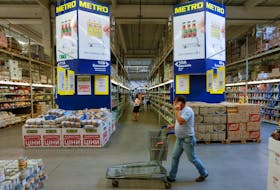 Customers shop at a Metro cash and carry store in Kiev, Ukraine, August 17, 2016. 