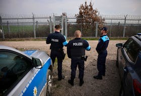 Frontex border police from Germany and Greece are pictured near a fence at the border between Bulgaria and Turkey, near Kapitan Andreevo, Bulgaria, February 29, 2024. 