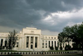 Early summer storm clouds gather over the U.S. Federal Reserve Building before an evening thunderstorm in Washington June 9, 2006.