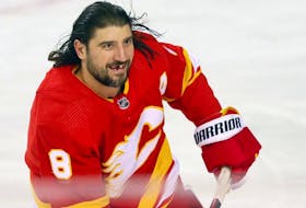 Calgary Flames Chris Tanev during warmup before taking on the Dallas Stars at the Scotiabank Saddledome in Calgary on Thursday, November 30, 2023. 