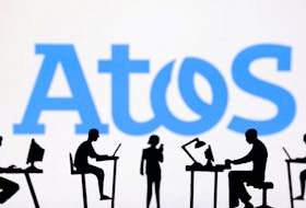 Figurines with computers and smartphones are seen in front of Atos logo in this illustration taken, February 19, 2024.