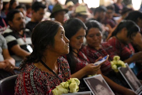 Relatives of victims of the 2012 Alaska Summit case, in which the military shot to disperse people and killed six people in indigenous protests, listen to the reading of the sentence against military personnel accused in a hearing room at the Supreme Court of Justice building in Guatemala City, Guatemala February 28, 2024.REUTERS/Cristina Chiquin