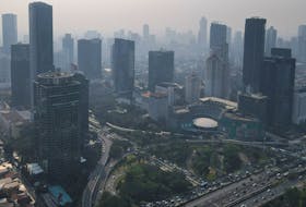 General view of high-rise buildings shrouded in smog during morning rush hour in Jakarta, Indonesia, August 23, 2023.