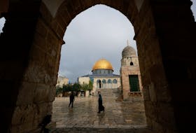Palestinians walk front of the Dome of the Rock on Al-Aqsa compound, also known to Jews as the Temple Mount, in Jerusalem's Old City, February 19, 2024.