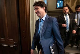 Prime Minister Justin Trudeau walks past journalists as he makes his way to caucus, February 28, 2024.