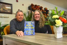 Larry Peters and daughter Amanda Peters after a recent book reading and signing in Wilmot. Larry Peters’ stories inspired the setting and atmosphere for her award-winning book, The Berry Pickers.   
Lawrence Powell • Special to the Annapolis Valley Register