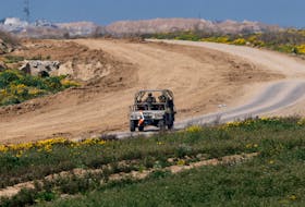 A military vehicle maneuvres near the Israel-Gaza border, amid the ongoing conflict between Israel and the Palestinian Islamist group Hamas, in Israel, February 28, 2024.
