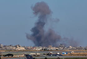 Smoke rises during an Israeli ground operation in Khan Younis, amid the ongoing conflict between Israel and the Palestinian Islamist group Hamas, as seen from a tent camp sheltering displaced Palestinians in Rafah, in the southern Gaza Strip, February 29, 2024.