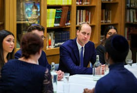 Britain’s Prince William sits with young people, affected by anti-Semitism, together with Holocaust Educational Trust ambassadors, as he visits the Western Marble Arch Synagogue, in London, Britain, February 29, 2024.