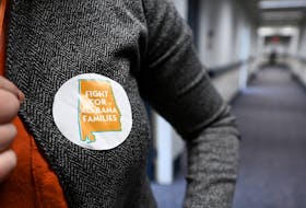 A person wears a sticker reading " Fight for Alabama families" as supporters of legislation safeguarding in vitro fertilization (IVF) treatments hold a rally at the Alabama State House in Montgomery, Alabama, U.S. February 28, 2024. 