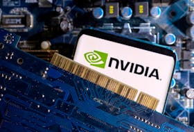 A smartphone with a displayed NVIDIA logo is placed on a computer motherboard in this illustration taken March 6, 2023.