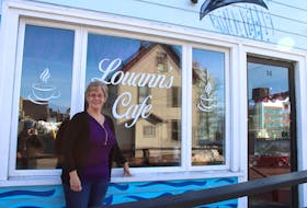 Louann MacDonald at the new Louann's Café on Wentworth Street in Sydney, shortly after putting up some signage. With an opening date planned for March 4, it's MacDonald's shop's first time back in business in more than 17 months after damages from post-tropical storm Fiona forced her to look for a new location. LUKE DYMENT/CAPE BRETON POST