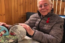 Carl MacLeod in 2019 with tins of Christmas baked good that he sold yearly for the MS Christmas Cake fundraiser. Since 1993, MacLeod fundraised for the MS Society after his wife was diagnosed with the disease. CONTRIBUTED