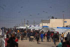 Aid is air-dropped over Gaza, amid the ongoing the conflict between Israel and Hamas, in Rafah in the southern Gaza Strip, February 27, 2024.