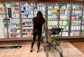A woman shops in a supermarket as rising inflation affects consumer prices in Los Angeles, California, U.S., June 13, 2022.