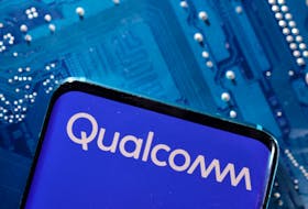 A smartphone with a displayed Qualcomm logo is placed on a computer motherboard in this illustration taken March 6, 2023.
