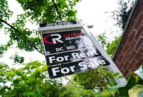 A "For Rent, For Sale" sign is seen outside of a home in Washington, U.S., July 7, 2022.