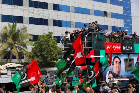 Supporters of Bilawal Bhutto Zardari, Chairman of the Pakistan Peoples Party (PPP), gather around his vehicle during an election campaign rally, ahead of the general elections, in Karachi, Pakistan, February 5, 2024.