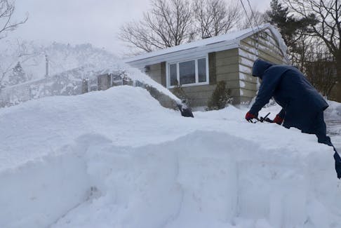 Wendell Coveyduck works on the drift in the driveway of his Moira St home in Dartmouth Feb 5 2024

TIM KROCHAK PHOTO