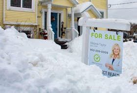 A for sale sign peeks out of the snow in front of an Armdale home on Monday, Feb. 5, 2024.
Ryan Taplin - The Chronicle Herald