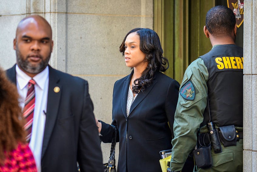 Baltimore City State's Attorney Marilyn Mosby (C) departs the courthouse on the first day of the Caesar Goodson trial in Baltimore, Maryland, U.S., June 9, 2016.