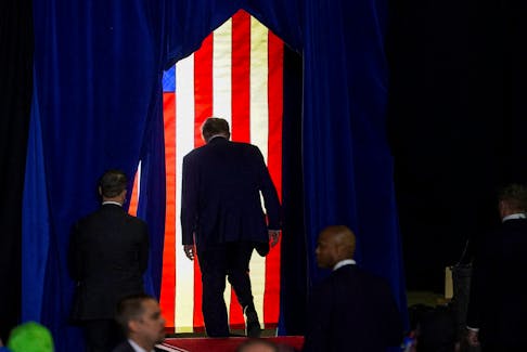 Republican presidential candidate and former U.S. President Donald Trump walks during a rally ahead of the New Hampshire primary election in Manchester, New Hampshire, U.S. January 20, 2024.