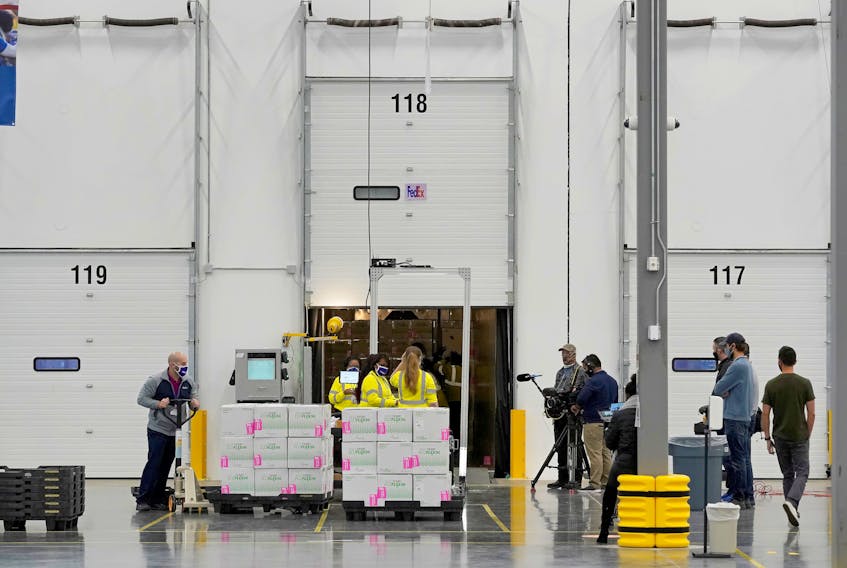 Boxes containing the Moderna COVID-19 vaccine are prepared to be shipped at the McKesson distribution center in Olive Branch, Mississippi, U.S. December 20, 2020. Paul Sancya/Pool via
