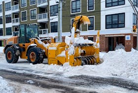 Charlottetown's public works department says plows like this one have been working since the storm let up to remove snow from Charlottetown streets. Cleanup has been underway across the province after this past weekend's storm dumped more than 60 cm of snow in parts of P.E.I. Tristan Hood • The Guardian