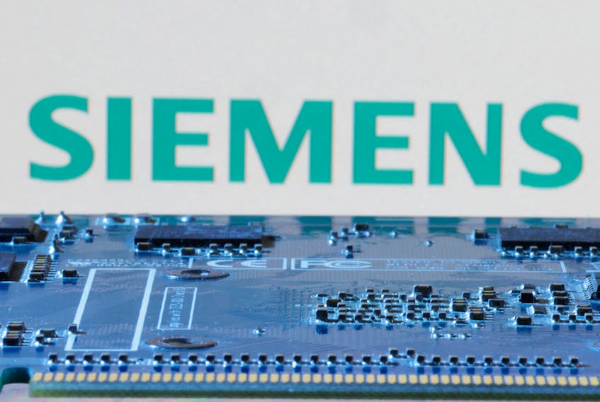 Siemens logo is seen near computer motherboard in this illustration taken January 8, 2024.