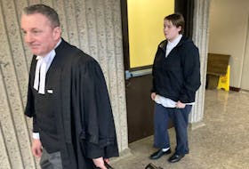 Chloe Wile, 21, leaves Nova Scotia Supreme Court in Halifax with lawyer Josh Nodelman on Wednesday after pleading guilty to five charges, including procuring a person under the age of 18 to provide sexual services for consideration and receiving financial benefit from those sexual services. Wile's sentencing hearing is tentatively set for April 24.