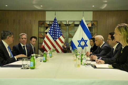 U.S. Secretary of State Antony Blinken meets with Israeli opposition leader Yair Lapid, in Tel Aviv, Israel, Thursday, Feb. 8, 2024. Mark Schiefelbein/Pool via REUTERS