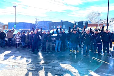 Fishermen from around the west coast raise their hands during a demonstration in Corner Brook on Thursday, Feb. 8, to signify that they won’t have a job if they don’t get a bigger share of the redfish quota. - Diane Crocker/SaltWire