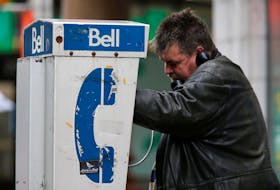 A man uses a Bell Canada payphone in Ottawa, Ontario, Canada, November 1, 2017.