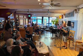 Author TP Wood reads his work to a packed room at Shaun's in New Glasgow this past summer. Sarah Butland is hoping Love Fest Open Mic will have a similar turn-out and more open mic events can happen in the future.