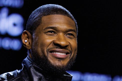 Usher poses for pictures after taking part  in a moderated conversation ahead of Super Bowl LVIII in Las Vegas, Nevada, U.S., February 8, 2024. 