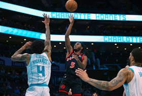 Immanuel Quickley of the Raptors attempts a jump shot during the first half against the Charlotte Hornets at Spectrum Center on Feb. 7, 2024 in Charlotte, N.C. 