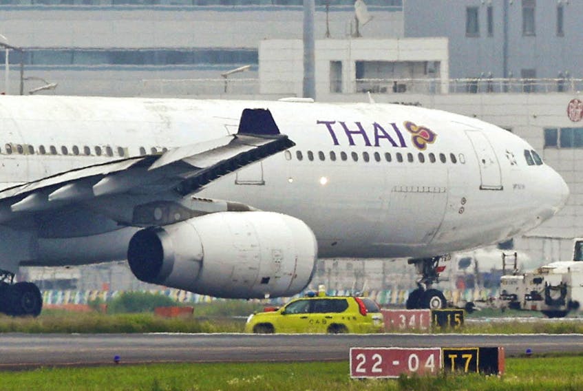 A Thai Airways aeroplane is seen after making contact with Eva Air aeroplanes at Haneda Airport, in Tokyo, Japan, June 10, 2023, in this photo released by Kyodo. Mandatory credit Kyodo via