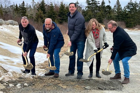 Barrington Municipal councillors, from left, Shaun Hatfield, George El Jalk, Deputy Warden Jody Crook, Andrea Mood Nickerson and Warden Eddie Nickerson scoop up a shovel full of dirt where the new municipal recreation centre is going to be built, adjacent to the Sandy Wickens Memorial Arena, during a sod-turning ceremony on Feb. 7. Kathy Johnson