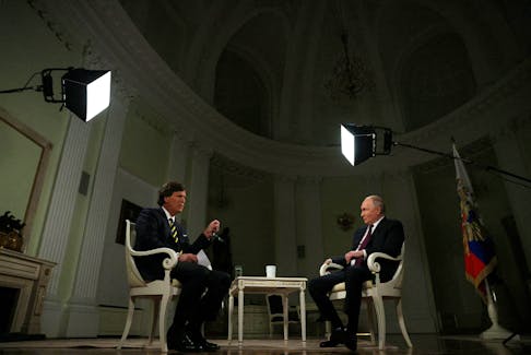 Russian President Vladimir Putin listens during an interview with U.S. television host Tucker Carlson in Moscow, Russia February 6, 2024. Sputnik/Gavriil Grigorov/Kremlin via REUTERS