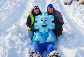 Wayne Long, left, events development officer with the City of Charlottetown, and Russell Hambly, volunteer, have some fun with the Jack Frost mascot on the ice slide at the Confederation Landing Park in this file photo. The outdoor snow kingdom is moving from downtown Charlottetown to the Mark Arendz Provincial Ski Park at Brookvale for 2024. The winter festival goes Feb. 16-19. – File