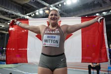 Canada's Sarah Mitton of Brooklyn celebrates after winning the women's shot put final at the world indoor athletics championships in Glasgow, Scotland, on Friday. REUTERS/Hannah Mckay