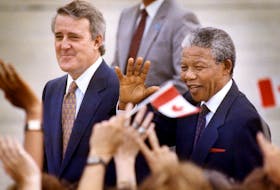 Nelson Mandela walks with Prime Minister Brian Mulroney on his arrival in Ottawa for a three day visit to Canada, June 17, 1990
