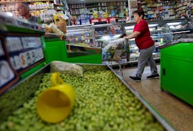 A woman does the shopping in a supermarket in Bogota, Colombia October 30, 2018.