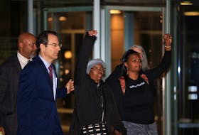 Sheneen McClain gestures as she exits the Adams County District Court with Colorado Attorney General Phil Weiser after a jury delivered a guilty verdict of criminally negligent homicide for two paramedics who in 2019 injected her son Elijah McClain, an unarmed Black man, with ketamine after he was detained and subdued by police, outside in Brighton, Colorado, U.S., December 22, 2023. 